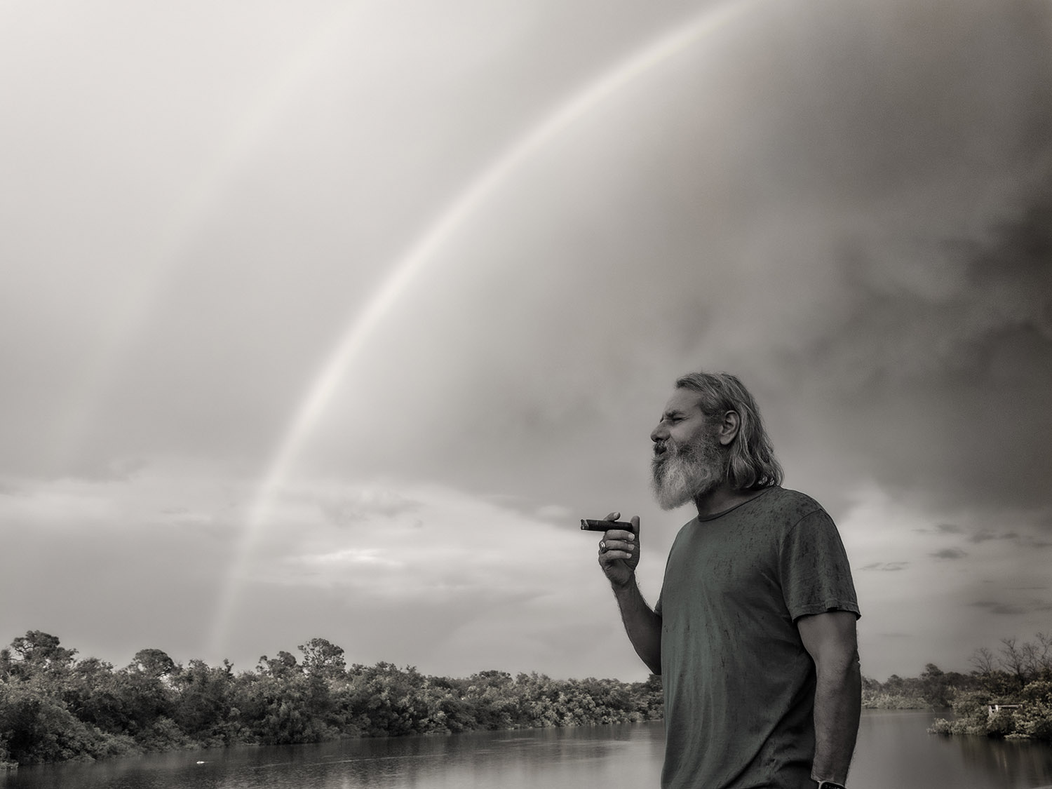 Benny Traub contemplating under a rainbow - symbolizing vision and leadership